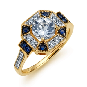 Złoty pierścionek z brylantami, białym topazem i szafirami RR52226SAPTOPY
