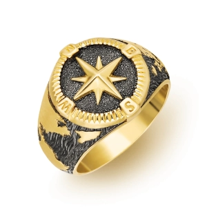 Złoty sygnet mapa świata i róża wiatrów Vento